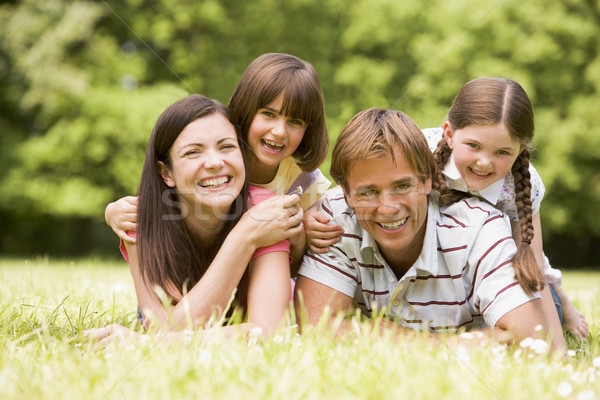 Stok fotoğraf: Aile · açık · havada · gülen · çiçek · mutlu · alan