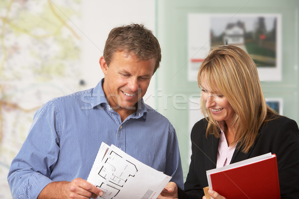 Female Estate Discussing Property Details With Client Stock photo © monkey_business