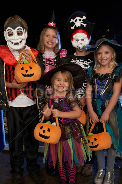 Stock photo: Happy Halloween party with children trick or treating