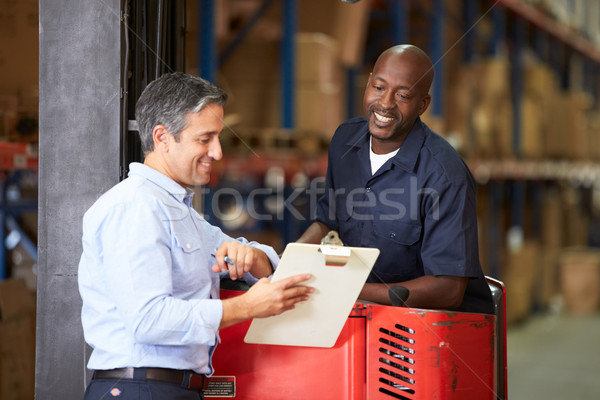 Fork Lift Truck Operator Talking To Manager In Warehouse Stock photo © monkey_business