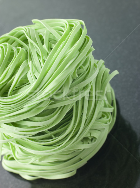 Stack of Spinach Noodles on a Black Background Stock photo © monkey_business