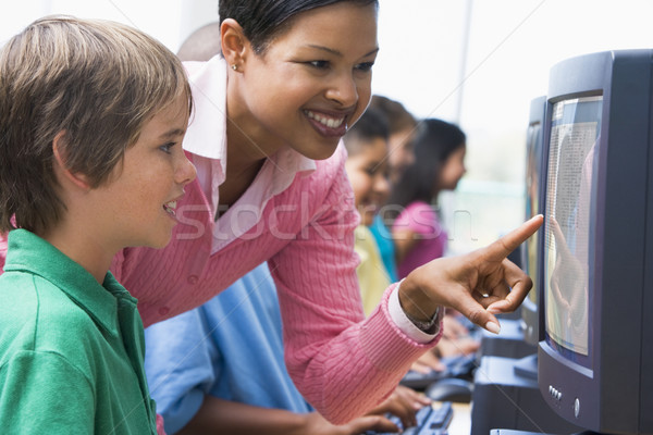 Computer classe insegnante bambini felice Foto d'archivio © monkey_business