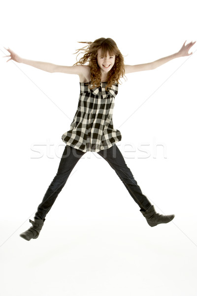 Jeune fille sautant air enfants enfant couleur Photo stock © monkey_business