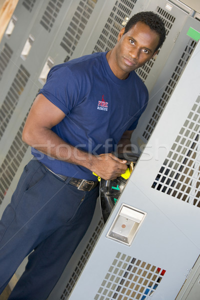 Portrait of a firefighter in the fire station locker room Stock photo © monkey_business