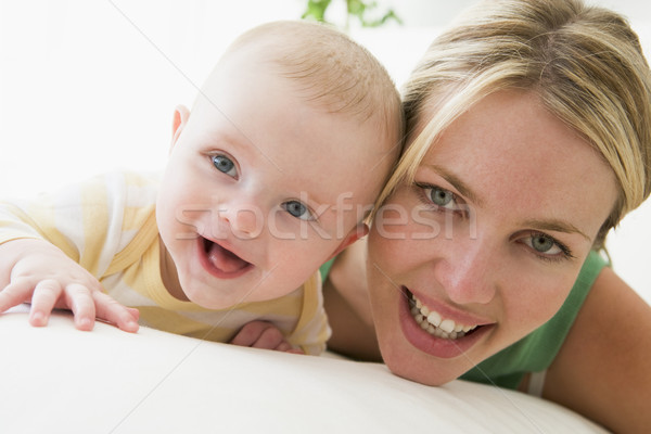 Mother and baby indoors smiling Stock photo © monkey_business