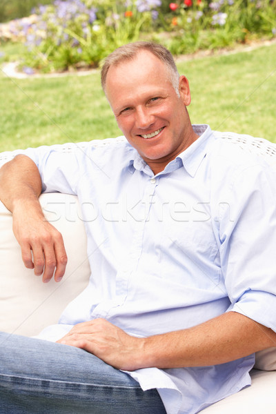 Középkorú férfi megnyugtató kert férfi portré személy Stock fotó © monkey_business