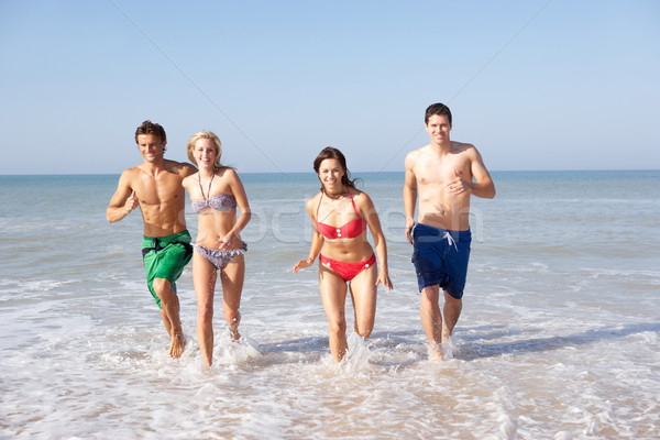 Two young couples on beach holiday Stock photo © monkey_business