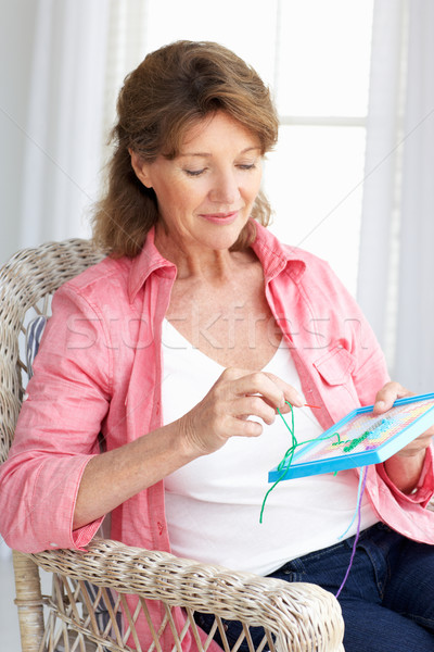 Senior woman doing cross stitch Stock photo © monkey_business