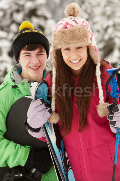 Stock photo: Two Teenagers On Ski Holiday In Mountains