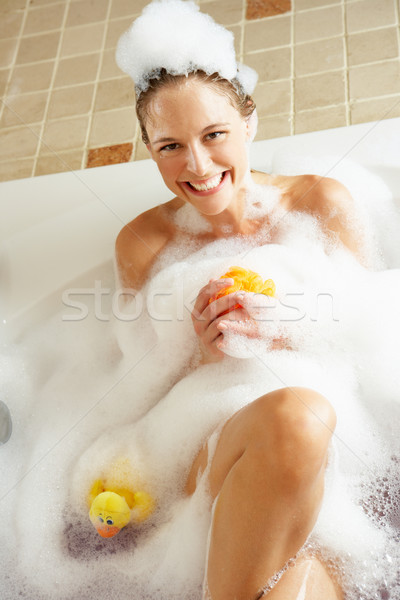 Woman Relaxing In Bubble Filled Bath Stock photo © monkey_business