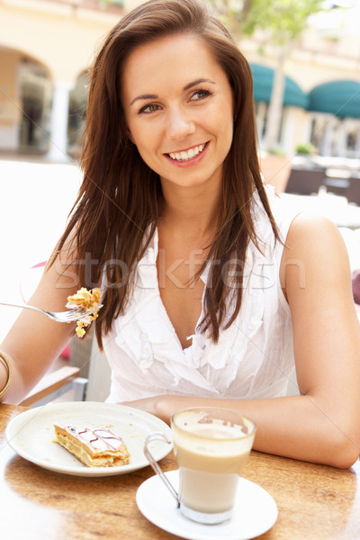 Young Woman Enjoying Coffee And Cake In Caf Stock photo © monkey_business