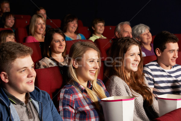 Group Of Teenage Friends Watching Film In Cinema Stock photo © monkey_business