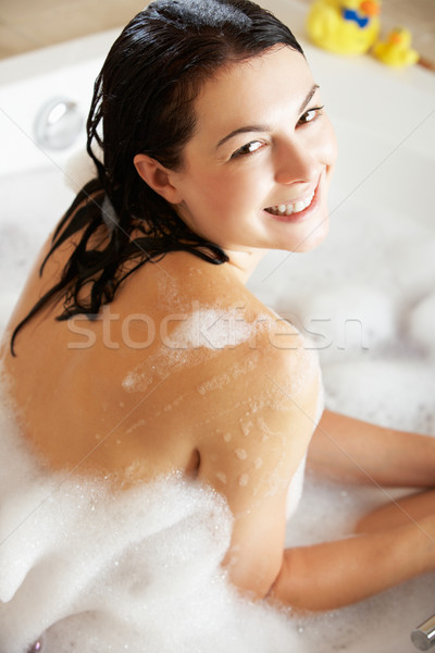 Woman Relaxing In Bubble Filled Bath Stock photo © monkey_business