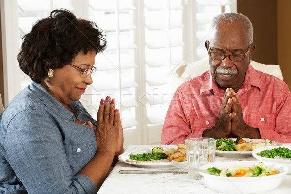Senior Couple Saying Grace Before Meal At Home Stock photo © monkey_business