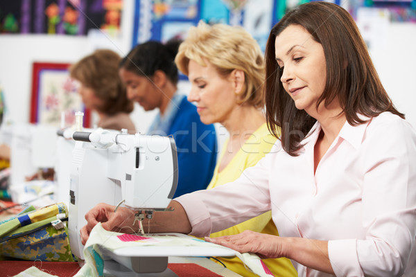 Group Of Women Using Electric Sewing Machines In class Stock photo © monkey_business