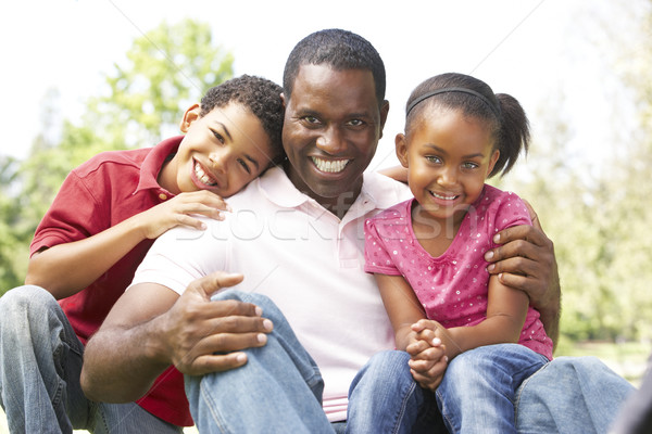 Stock photo: Father With Children In Park