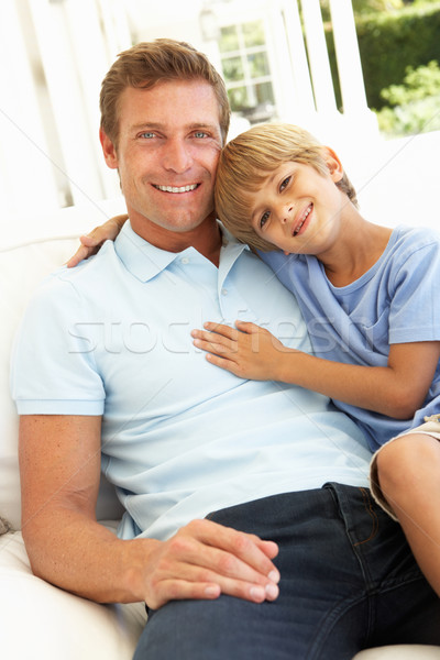 Portrait Of Father And Son Relaxing On Sofa Stock photo © monkey_business