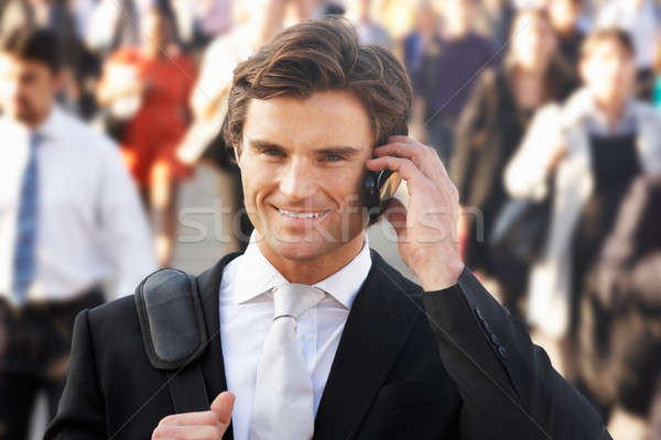 Homme banlieue foule téléphone ville heureux [[stock_photo]] © monkey_business