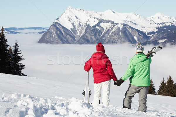 Couple Admiring Mountain View Whilst On Ski Holiday In Mountains Stock photo © monkey_business