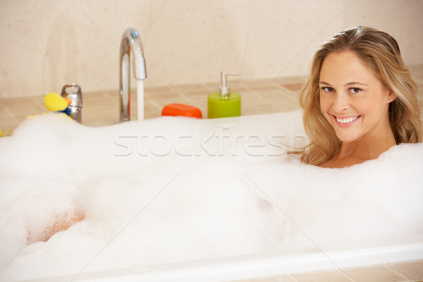 Woman Relaxing In Bubble Filled Bath Stock photo © monkey_business