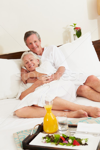 Senior Couple Relaxing In Hotel Room Wearing Robes Stock photo © monkey_business