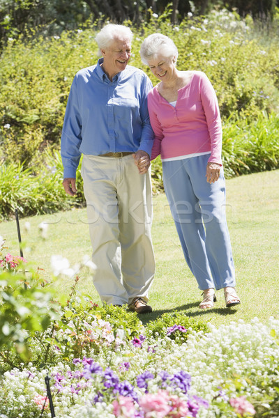 Senior couple walking in garden Stock photo © monkey_business