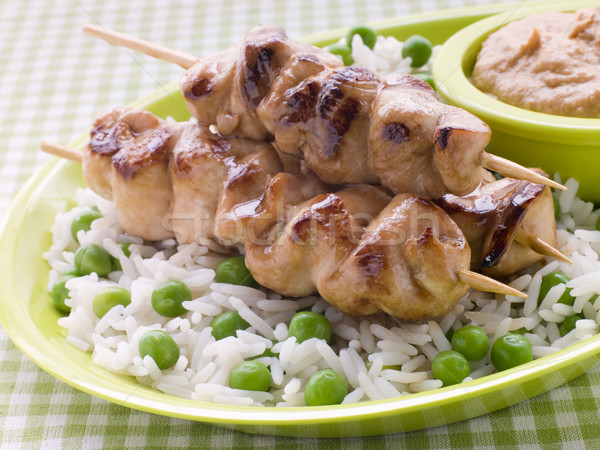 Stock photo: Chicken Satay Sticks with Peanut Butter Sauce and Fried Rice