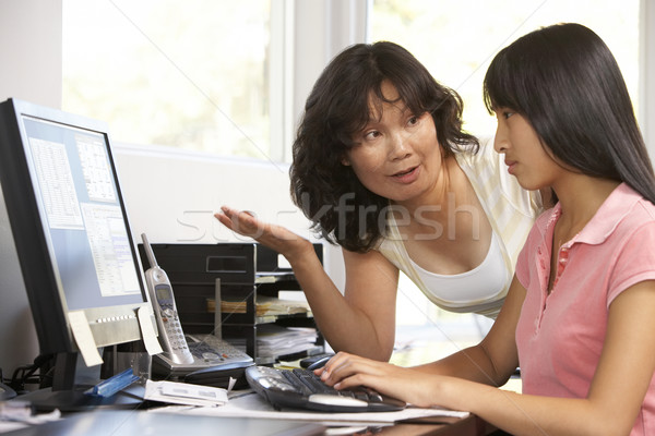 Woman Watching Her Daughter Use A Computer Stock photo © monkey_business