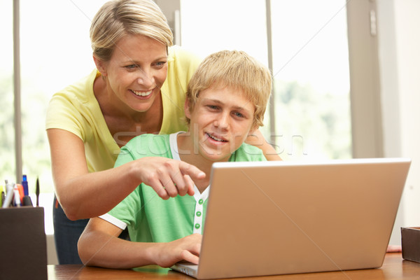 Mother And Teenage Son Using Laptop At Home Stock photo © monkey_business