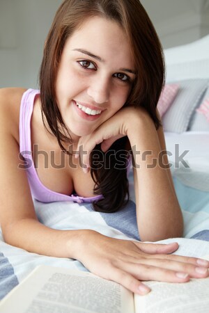 Teenage girl reading a book Stock photo © monkey_business