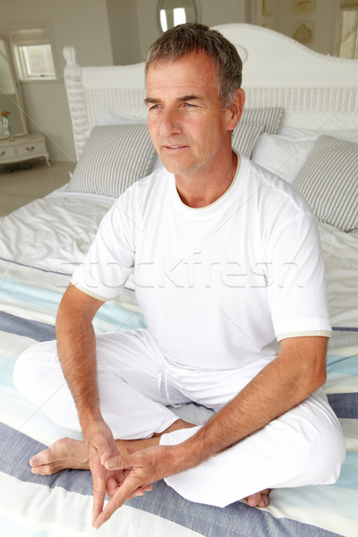 Mid age man in lotus position Stock photo © monkey_business
