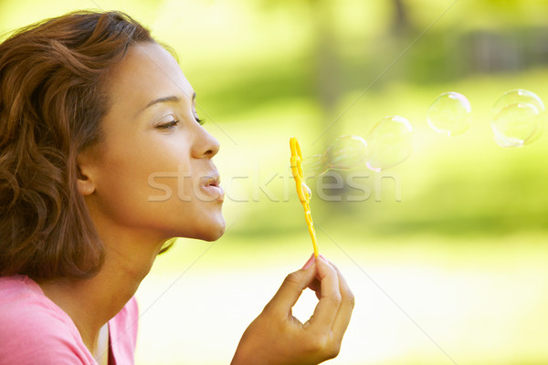 Young  woman blowing bubbles Stock photo © monkey_business