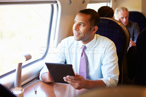 Stock foto: Geschäftsmann · Pendeln · Zug · digitalen · Tablet · Technologie