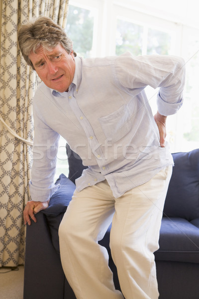 Mann Rückenschmerzen Gesundheit zurück Schmerzen Couch Stock foto © monkey_business