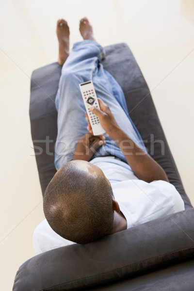 [[stock_photo]]: Homme · séance · président · télécommande · Homme · flou