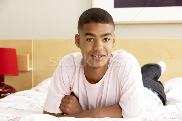 Portré tizenéves fiú hálószoba arc tinédzser mosolyog Stock fotó © monkey_business