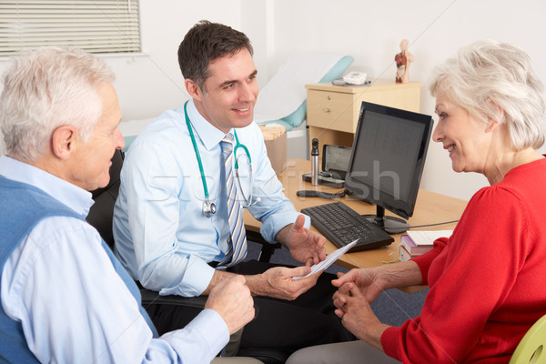 British GP talking to senior couple in surgery Stock photo © monkey_business