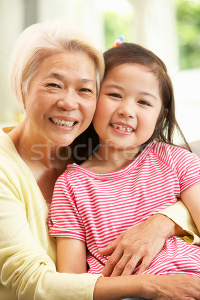 Chinois grand-mère petite fille détente canapé maison [[stock_photo]] © monkey_business