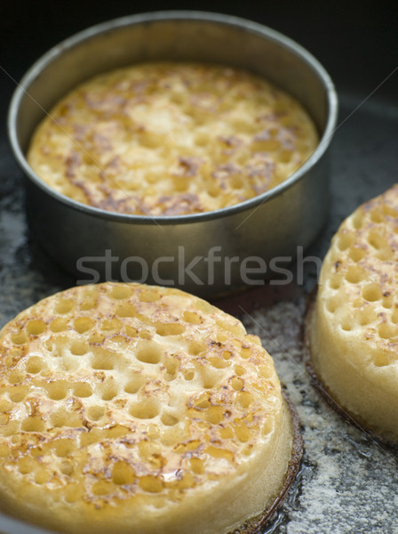 Stock photo: Cooking Crumpets in a Frying Pan