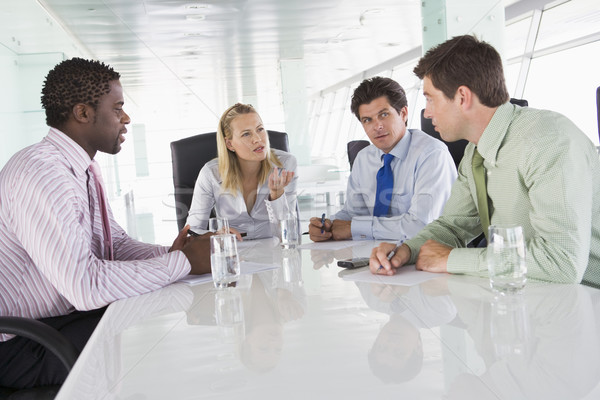 Quatro sala de reuniões falante homem pessoas de negócios Foto stock © monkey_business