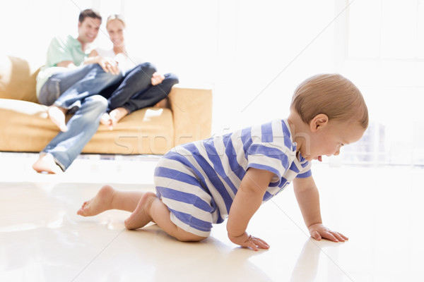 Couple in living room with baby smiling Stock photo © monkey_business