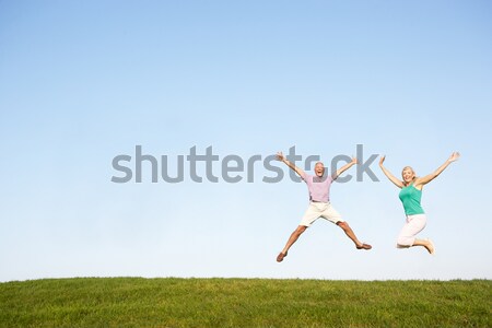 Young women jumping in air Stock photo © monkey_business