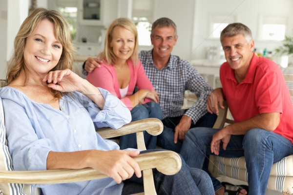 Mid age couples relaxing at home Stock photo © monkey_business