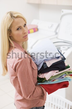 A young woman holding large underwear in the bathroom Stock photo © monkey_business