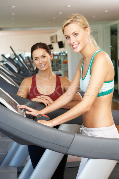 Woman Working With Female Personal Trainer On Running Machine In Stock photo © monkey_business