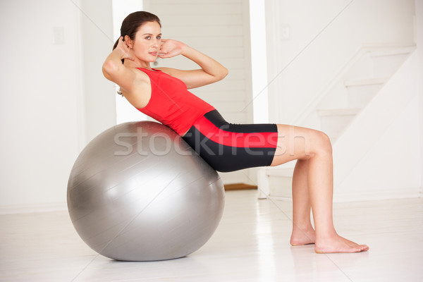 Woman with gym ball in home gym Stock photo © monkey_business