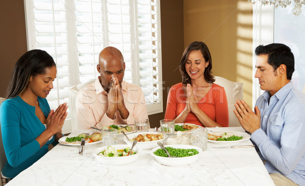 Group Of Friends Saying Grace Before Meal At Home Stock photo © monkey_business