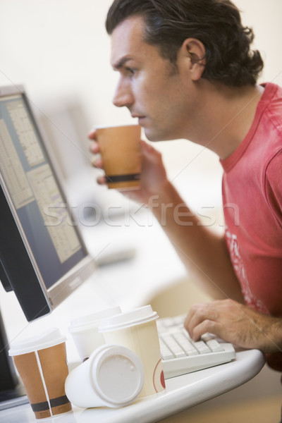 Man in computer room with many empty cups of coffee Stock photo © monkey_business