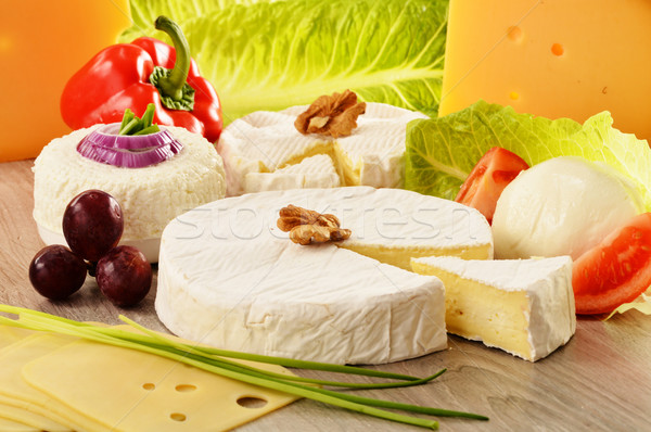 Composition with different sorts of cheese on wooden table Stock photo © monticelllo