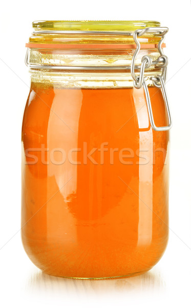 Jar of honey isolated on white Stock photo © monticelllo